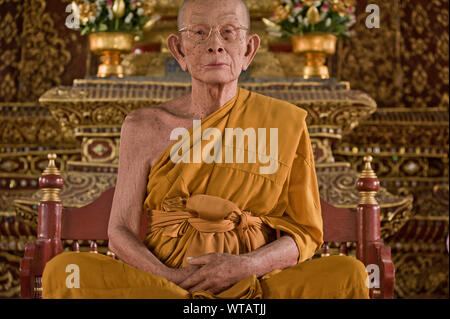 Glass fiber`s statue monk in the Wat Phra Sing temple Stock Photo